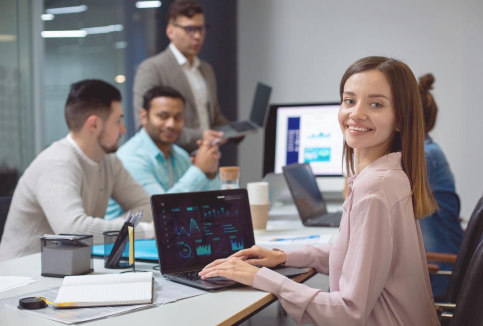 Database programming workspace with multiple monitors displaying SQL queries